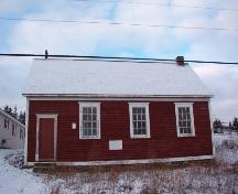 View of main facade which overlooks the harbour, Otterbury Schoolhouse, Water Street, Harbour Grace, NL.  Photo taken November 1, 2005.; HFNL/ Deborah O'Rielly 2005.