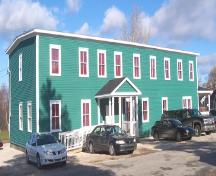 Exterior view of front and right facades, International Pulp and Paper Company Staff House, Deer Lake, NL, after restoration was completed.; HFNL 2005