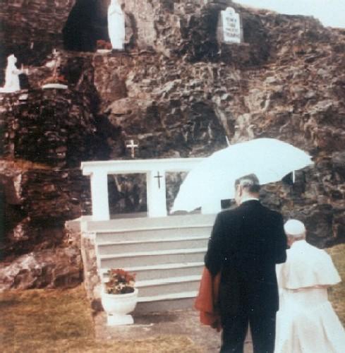 Pope John Paul II kneeling at the Grotto in 1984.