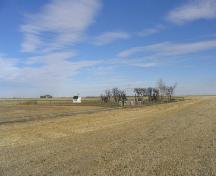 View northeast at cemetery site surrounded by grain fields, 2005.; Government of Saskatchewan, Marvin Thomas, 2005.
