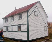Exterior view of front and side facades of Lane House, Tilting, Fogo Island. Note the outline of the form of the original structure.; 2006 HFNL