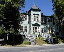 James Simmonds House, projecting two storey square bay with pediment over three paned first storey window, hooded second storey double window, street level basement, Dartmouth, Nova Scotia, 2005.; Heritage Division, NS Dept. of Tourism, Culture and Heritage, 2005