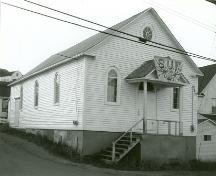 Exterior photo of St. Peter's Society of United Fishermen Lodge showing front and side facade, circa 1993.; HFNL 2005