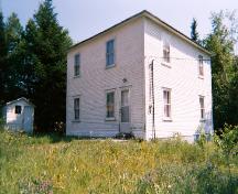 Exterior view of Stanley Ford House showing front and right sides, with storage shed at left, Jackson's Arm, NL, 2005.; Town of Jackon's Arm, 2005.
