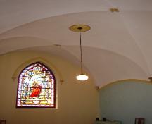 Interior view of ribbed vault ceiling and stained glass window, Chapel, Holy Trinity Convent, Witless Bay, NL.; HFNL 2005