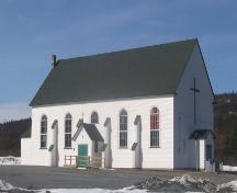 Looking north to view of side and front facade of St. Charles Borromeo Church, Fermeuse, NL. Photo taken April 2006.; 2006 HFNL/Andrea O'Brien