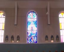 Interior view of recent stained glass flanked by original stained glass in St. Charles Borromeo Church, Fermeuse, NL. Photo taken April 2006.; 2006 HFNL/Andrea O'Brien