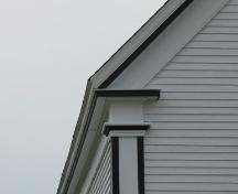 Detail showing return eaves and corner board designed as a Greek pilaster with a simple capital.  Saint Andrews Presbyterian Church, Rose Bay, Lunenburg County, Nova Scotia, 2006.; Heritage Division, Nova Scotia Department of Tourism, Culture and Heritage, 2006.