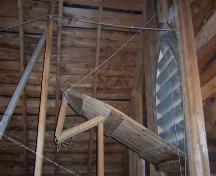Shows the rope pulley system used to open the ventilation system in the church from the main floor.  LaHave Island Marine Museum, Jenkin's Islands, LaHave Islands, Lunenburg County, Nova Scotia, 2006.; Courtesy of the LaHave Islands Marine Museum.