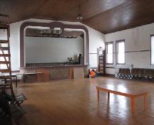 View of the assembly room in  Craik Town Hall featuring the stage, 2006.; Saskatchewan Architectural Heritage Society, Frank Kovermaker, 2006.