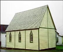 View of side and gable end of Bailey's Cove Church of England School, Bonavista, after restoration; HFNL 1998