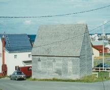 Exterior view of Bailey's Cove Church of England School, Bonavista, NL before restoration; HFNL 1998