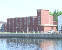 Waterfront view of the FPU Factory/Advocate Building, Port Union, showing rear and left side, circa 2004. ; Sir William Coaker Heritage Foundation, 2004