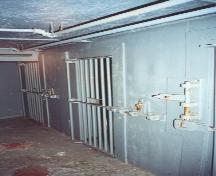Interior photo showing jail cells, St. George's Courthouse, NL.  Cells were used to hold prisoners when making court appearances.  Photo taken around 2004, prior to restoration.; HFNL 2006