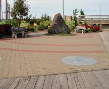 The cairn, paving stone name plates and inscription stone honour the first permanent settlers to arrive in Moncton.; Moncton Museum