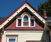 Palladian windows with stained glass, surrounded by scalloped shingles and decorative bargeboard, Murray House.; Heritage Division, NS Dept. of Tourism, Culture and Heritage, 2006