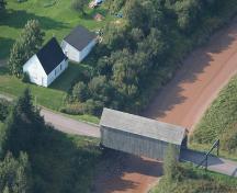 Former Gayton School - Aerial view showing the school on the left (east) side of the Memramcook River near the Gayton covered bridge; Memramcook Valley Historical Society