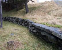 View of stone wall surrounding the Mother M. Bernard Kirwan Memorial. Photo taken December, 2005.; HFNL/Andrea O'Brien 2005