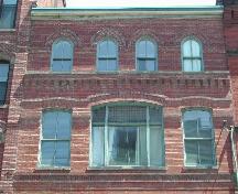 This photograph shows the original top storey and the storey that was added in 1914, 2005; City of Saint John
