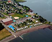 Aerial view west showing showing beach, Inch Arran Park and Inch Arran Ice Palace/Recreaplex.; Convince Graphics, Campbellton