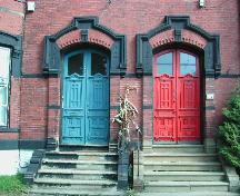 This photograph shows the elaborate entranceways that add great architectural value to this complex, 2004; City of Saint John