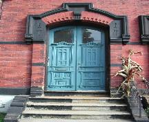 This photograph shows the prominent blue door and elaborate entrance, 2004; City of Saint John