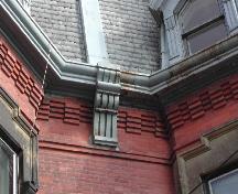 This photograph shows the corbel bands and brackets, 2004; City of Saint John