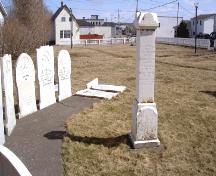 View of headstones and Loyal Orange Lodge monument acknowledging the loss of the Nellie Harris and Tubal Cain, Frazer Park, Grand Bank, NL. ; HFNL/Robert Parsons 2007