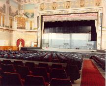 Photograph from the parquet circle to the front of the Outremont Theatre, showing a part of the Art Deco patterns and paints, 1987.; Ministère de la Culture et des Communications, Québec. Normand Rajotte, MC 87.105.2, 1987.