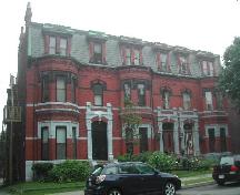 This photograph provides a contextual view of the three dwelling complex on Germain Street, including the John F. Bullock Residence, 2005. ; City of Saint John