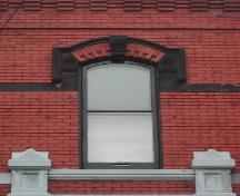 This image provides a view of the second storey segmented arched center window, 2005.; City of Saint John