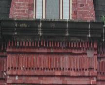 This photograph shows the cornice ornamented with brick dentils, 2005.; City of Saint John