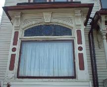 Stained glass and carved mullions are features of the front bay window.; City of Windsor, Nancy Morand