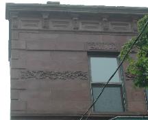 This photograph shows the cornice supported by acanthus leaf brackets, 2005.; City of Saint John