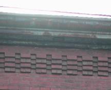 This image provides a view of the cornice ornamented with brick corbel bands, 2005; City of Saint John