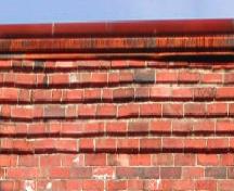 This image provides a view of the brick corbel band pattern below the cornice, 2005. ; City of Saint John