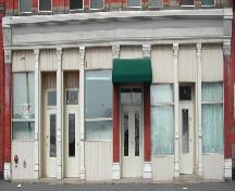 This photograph shows the pilasters in the storefront with Corinthian capitals, 2005; City of Saint John