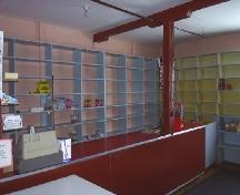 Interior photo view of Long Island Consumers Co-op Store showing retail counter, shelves and support beam, NL, 2007; Town of Lushes Bight-Beaumont, 2007