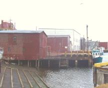 Left and front facades of Stoodley Fishing Stage, Grand Bank, NL. Photo taken April 2006. ; HFNL/Andrea O'Brien 2007
