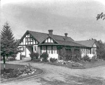 Exterior southwest view of the Allen Bungalow and garden (circa 1940); Red Deer and District Archives – Call No. PA 004-1