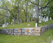 View of granite wall surrounding part of cemetery, Old Kirk Burying Ground, Shelburne, 2004.; Heritage Division, NS Dept. of Tourism, Culture and Heritage, 2004