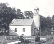 Chapel as it was when built circa 1840 with rectangular windows and  bell tower with octagonal cupola. Photo taken in 1905 by Father Joseph Courtois, Eudist. ; Fidèle Thériault Collection