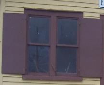 View of window with wooden shutters, Fishermen’s Union Trading Company Cash Store, Musgrave Harbour, 2007.; HFNL 2007