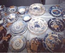 Plates, saucers and tea cups excavated from privy; OHT