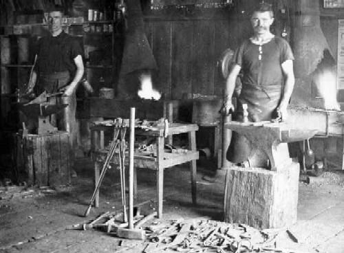 Moir at work in his blacksmith shop, c. 1909