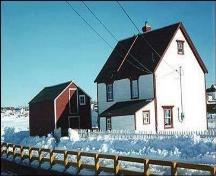 Rear view of Adam Mouland House, Bonavista, showing its linhay and the fish store on the property, circa winter of 1998.; HFNL 1998