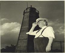 John Sutherland standing in front of the Port Burwell Lighthouse; Port Burwell Marine Museum, Museums of Bayham