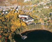 Aerial view of Glynmill Inn, shown in its environmental setting. Note the forested area and Glynmill Inn Pond at the rear of the photo.; HFNL 2008