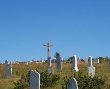 View of cemetery showing various gravemarkers and crucifix.  Photo taken September 2006.; HFNL/ Dale Jarvis 2006
