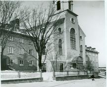 Corner view of the Bon-Pasteur Chapel, showing the Bon-Pasteur wing on the left and the Marie-Fitzbach wing on right, as seen ca. 1880.; Library and Archives Canada/ Bibliothèque et Archives Canada, PA 23915, ca. 1880.
